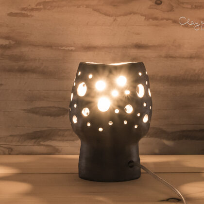 Handmade black pottery lamp. Lantern