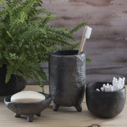 Handmade black pottery. Set for bathroom accessories