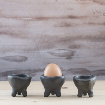 black pottery egg cup