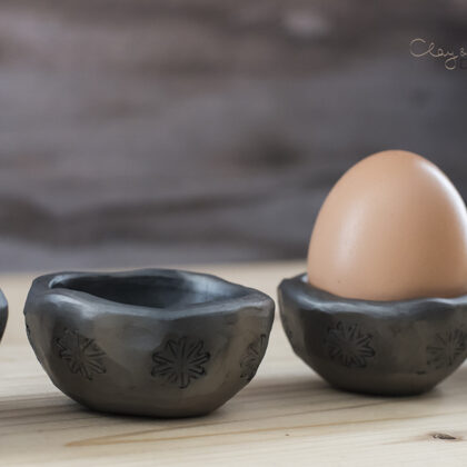set of egg holders for Easter breakfast table