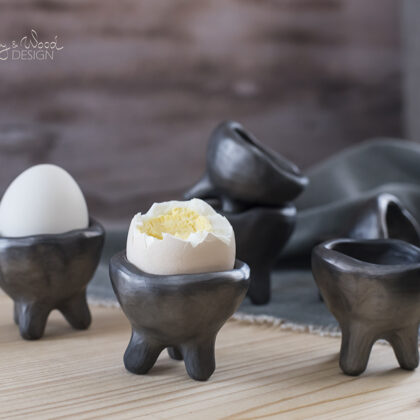 handmade black pottery egg cups on legs