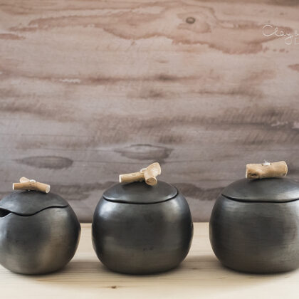 Handmade black pottery pots with lids
