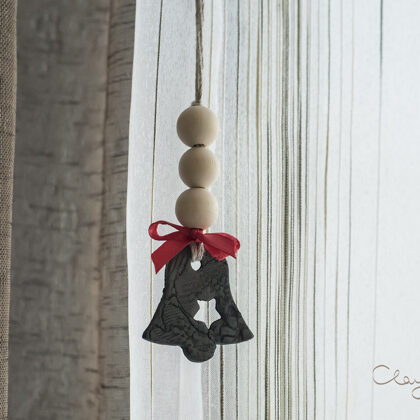 Christmas decors in shape of bell. Black pottery for modern Nordic home.