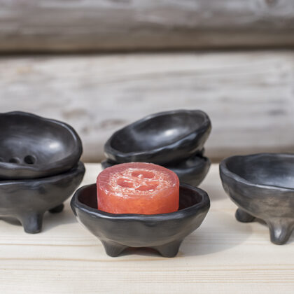 Handmade black ceramic soap dishes on legs with drainage hole for water
