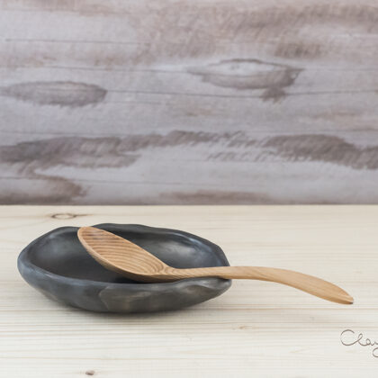 Handmade black ceramic spoon rest. 