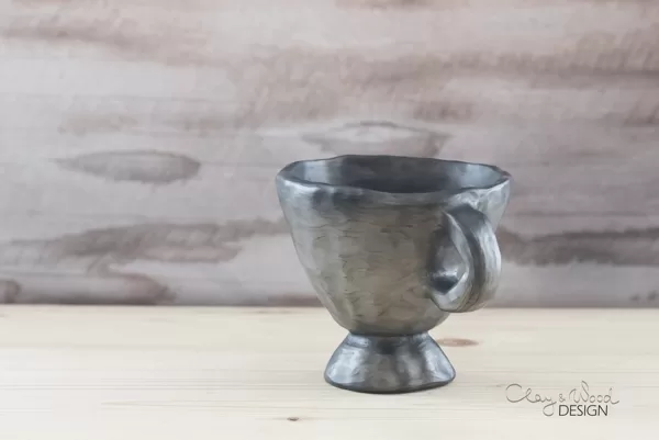 Black pottery mug for mulled wine