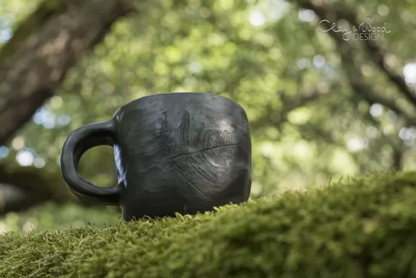 Black ceramic tea mug
