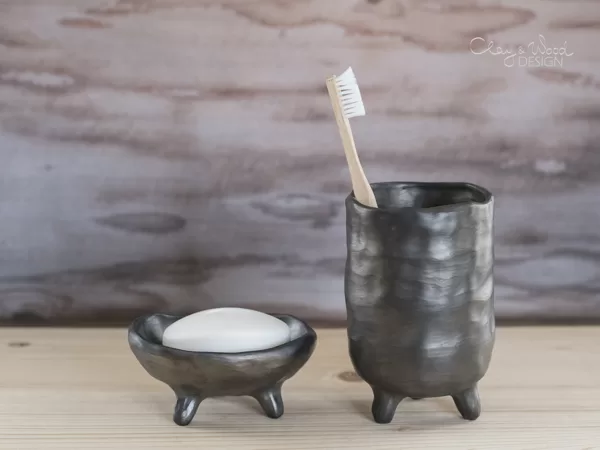 Sets for bathroom of black ceramic in minimalism style.