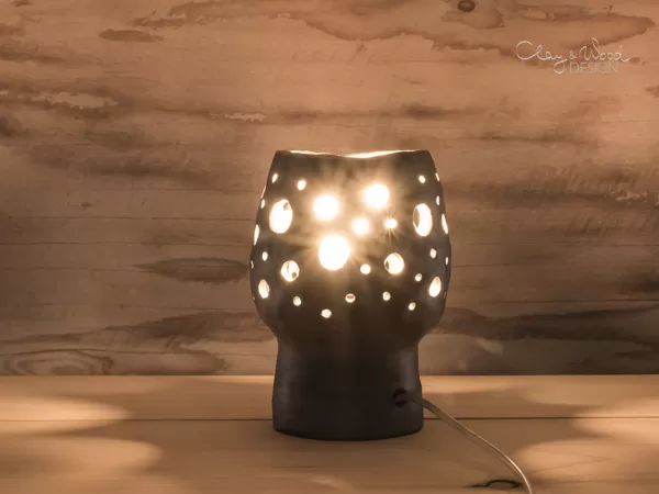 Handmade black pottery lamp. Lantern