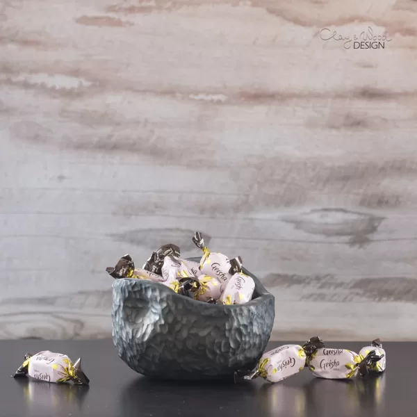 Handmade black ceramic dish for sweets