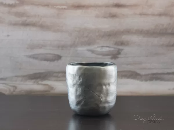 Handmade black pottery mug for coffee, tea or hot chocolate