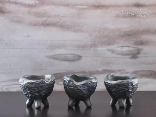 handmade black pottery egg holder