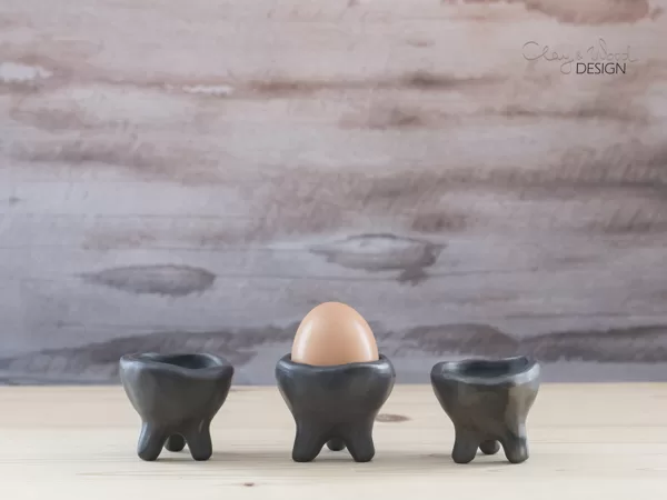 black pottery egg cup