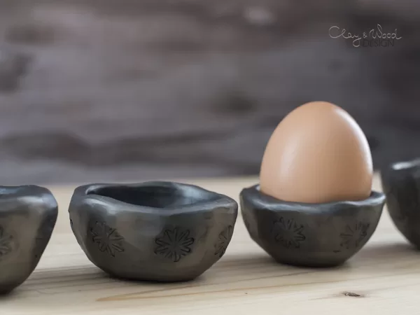 set of egg holders for Easter breakfast table