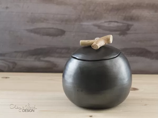 Black ceramic cellar for honey, sugar or salt with lid.