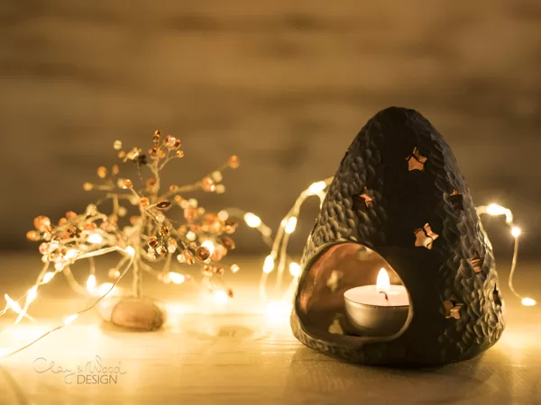 Candle holder for cozy autumn and winter evening mood. Black pottery.