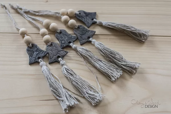 Christmas decors in shape of bell. Black pottery for modern Nordic home.