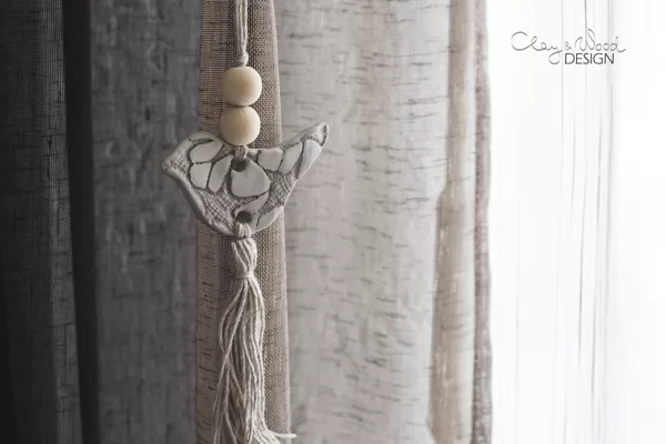Ornament in shape of bird. Handmade, ceramic. Almost white. Nordic home.
