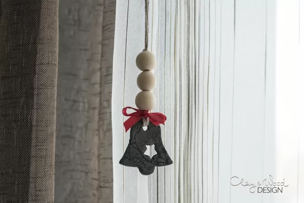 Christmas decors in shape of bell. Black pottery for modern Nordic home.