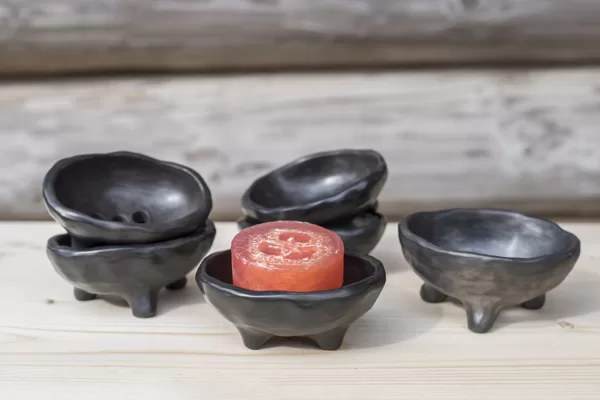 Handmade black ceramic soap dishes on legs with drainage hole for water