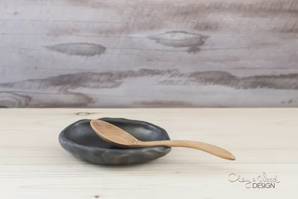 Handmade black ceramic spoon rest. 